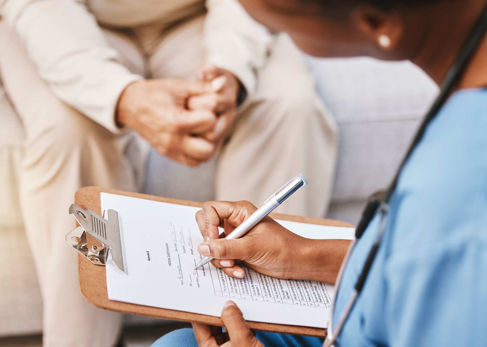 Nurse, clipboard and medical checklist with patient for healthcare, life insurance or hospital service. Closeup doctor writing notes, consulting and report documents of surgery, test results and data